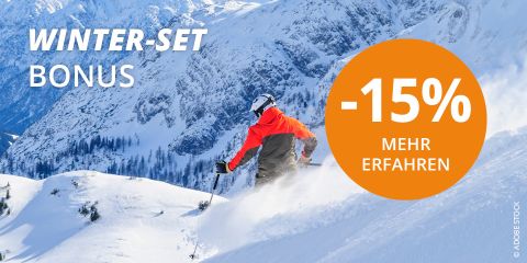 Un skieur portant une veste orange et grise dévale une montagne enneigée sous un ciel bleu clair. Le texte à gauche indique « BONUS ENSEMBLE D'HIVER » et à droite, un cercle orange affiche « -15 % EN SAVOIR PLUS ».