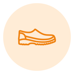 Le contour orange d'une chaussure sur un fond beige et circulaire.