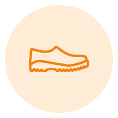 Dessin au trait orange d'une chaussure sur un fond circulaire beige clair. La chaussure a un design simple avec une semelle ondulée, typique des chaussures de loisirs ou de sport.
