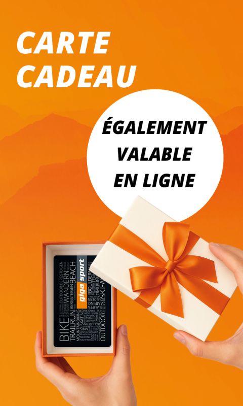 Des mains tiennent une boîte cadeau ouverte avec un ruban orange, révélant une carte cadeau "Giga Sport". Le texte se lit comme suit : "Carte Cadeau, Également valable en ligne.